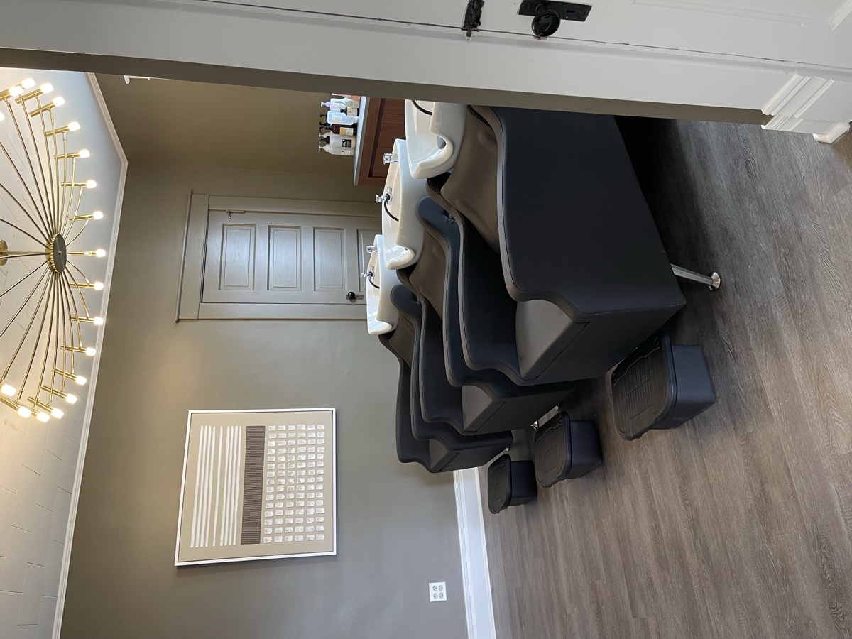 Salon chairs with natural light at Patina Salon